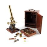 A Victorian brass microscope with slides, J T Slugg