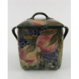 William Moorcroft for Liberty and Co., a Pomegranate on ochre biscuit box and cover