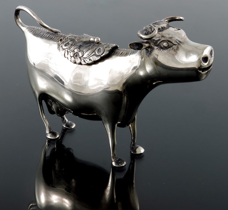 A Dutch silver cow creamer, in the form of a standing cow