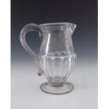 An 18th century glass ale jug