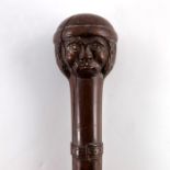 A 19th century tribal carved walking stick