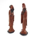 A pair of Chinese carved figures of Immortals