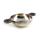 An Arts and Crafts, Scottish hardstone inlaid silver quaich, James Fenton