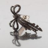 An Art Deco silver and marcasite clip