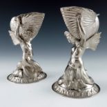 A pair of Victorian silver figural salt cellars and spoons, Smith, Nicholson and Co., London 1852