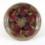 William Moorcroft for Liberty and Co., a Pomegranate on ochre plate
