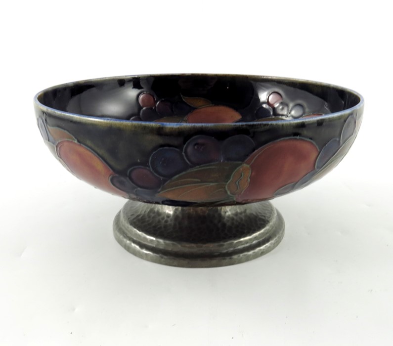 William Moorcroft for Liberty and Co., a Tudric pewter mounted Pomegranate bowl