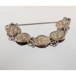 An Arts and Crafts silver button bracelet