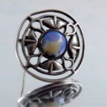 Archibald Knox for Liberty and Co., an Arts and Crafts silver and cabochon set brooch