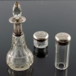 Three Victorian and Edwardian silver topped glass jars