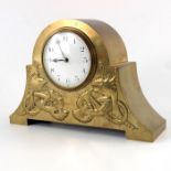 An Arts and Crafts brass clock