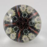 Paul Ysart attributed, a canes and cogs glass paperweight, 6cm diameter, 5.5cm high