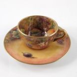 J Skerret for Royal Worcester, a miniature fruit painted cup and saucer