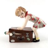 Stephan Dakon for Goldscheider, an Art Deco Austrian figure of a girl packing a suitcase