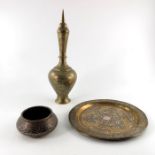 Three items of Persian metalware including a Cairo ware bowl and charger and an Islamic brass flask