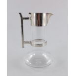 Christopher Dresser for Hukin and Heath, a silver plated and glass claret jug