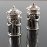 A pair of Edwardian silver salt and pepper shakers