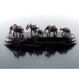 Patrick Mavros, an African Modernist silver and hardwood figure group of an elephant family