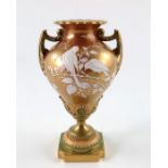 A Royal Worcester pate sur pate and tri colour gilt pedestal vase, 1898