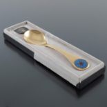 Georg Jensen, a Modernist silver gilt and enamelled year spoon