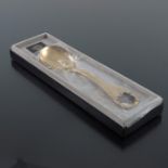 Georg Jensen, a Modernist silver gilt and enamelled year spoon