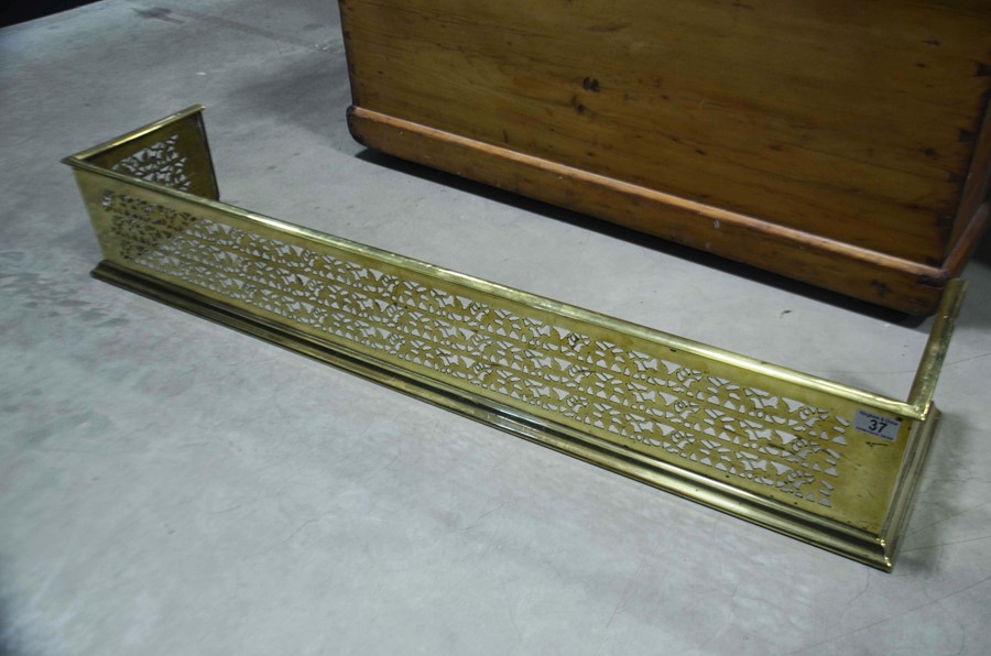 Brass fender with intricate pierced decoration, 11