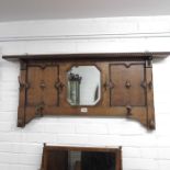A 1930's oak wall hanging hall mirror and coat rac