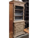 A 19th Century carved bookcase, upper section wit