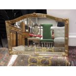 An overmantle mirror, arch form with gilded mirror