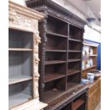A carved oak bookcase, upper and lower sections fi