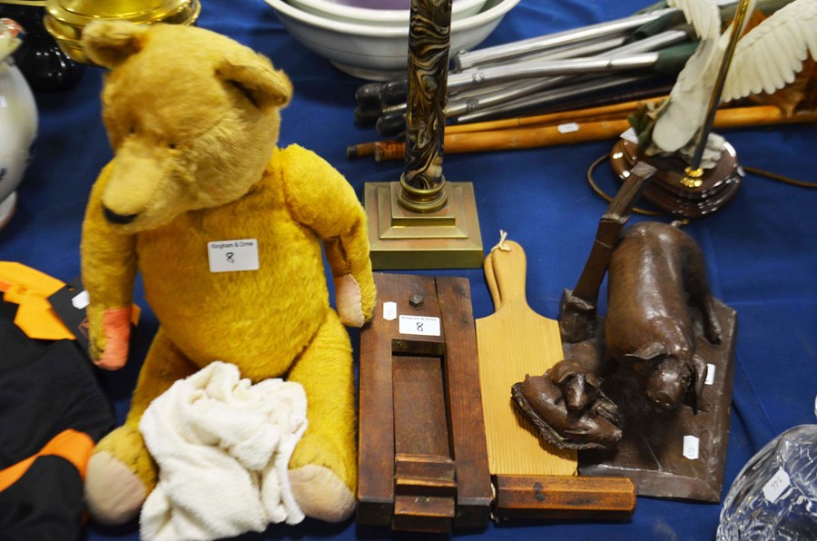 A vintage bear, a football rattle, butter pats and