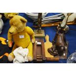 A vintage bear, a football rattle, butter pats and