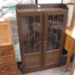 1930's oak bookcase fitted twin leaded doors above