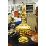 A giltwood tabler lamp, urn form on octagonal base