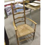 Oak rush seated armchair.