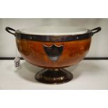 An oak silver mounted trophy bowl on circular socl