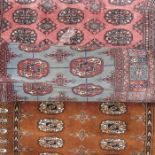 Three Persian style rugs, pink, blue and brown gro