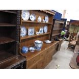 A fruitwood style dresser, shelved rack, the base
