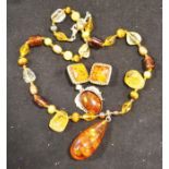 Amber teadrop pendant on citrine and pearl link ch