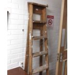 A pair of wooden step ladders.