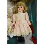 An Alberon small porcelain doll, blue eyes and cur