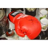 An Autographed Lonsdale boxing glove.