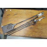 Three early Victorian fire irons, rope twist iron shafts, columnar