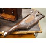 A moulded leather 'leg of mutton' gun case.