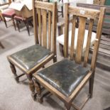 A pair of oak dining chairs, drop in leather seats