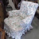 An Edwardian oak framed rocking chair,