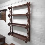 A set of four tiered wall hanging Mahogany shelves
