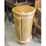 A Pine cylindrical pot cupboard and a leather topp