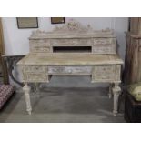 A 19th Century limed oak French style desk,carved d