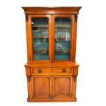 An early Victorian mahogany glazed bookcase bureau